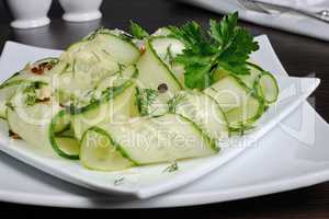 Salad from fresh cucumbers with garlic, dill, spices