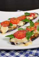 Baked eggplant with tomato and basil and cheese