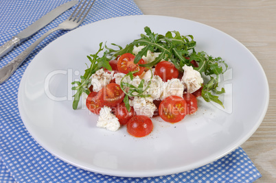 salad arugula with cherry tomatoes and mozzarella