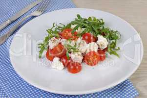 salad arugula with cherry tomatoes and mozzarella