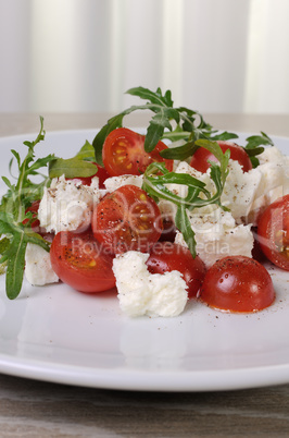 salad arugula with cherry tomatoes and mozzarella