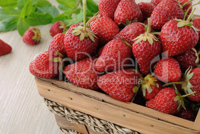 Basket full of strawberries on the table