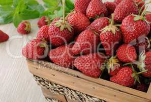 Basket full of strawberries on the table