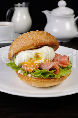 Burger with salmon and poached egg