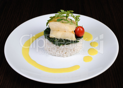 Flounder fillets with risotto and spinach