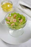 Salad of pineapple and shrimp in lettuce leaves