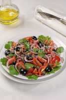 Tomato salad with olives, capers and cilantro