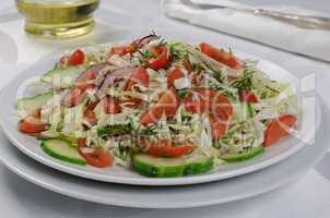 Cabbage salad with cucumber and tomatoes
