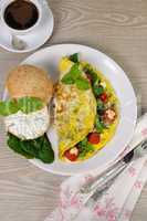 Omelet with spinach, basil, cherry tomatoes and cheese Adyg