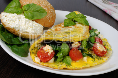 Omelet with spinach, basil, cherry tomatoes and cheese Adyg