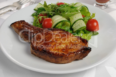 Grilled steak with vegetables on bone