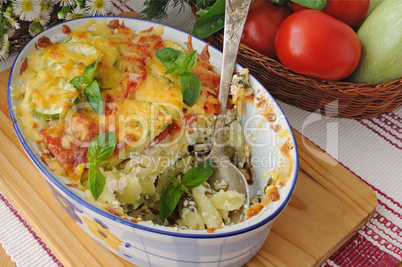 casserole of pasta with zucchini and tomato , cheese