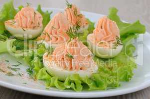 Eggs stuffed with salmon pate in lettuce leaves