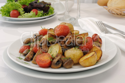 Baked mushrooms with potatoes and tomatoes