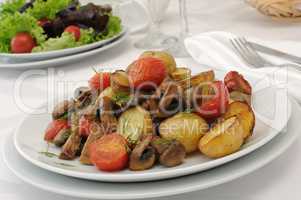 Baked mushrooms with tomatoes and potatoes