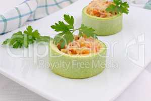 Zucchini stuffed with vegetables with rice and cheese