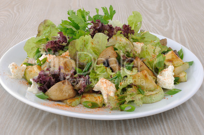Salad with mushrooms with zucchini, cheese in lettuce leaves and
