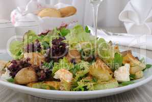 Salad with mushrooms with zucchini, cheese in lettuce leaves