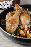 Roasted chicken drumstick with vegetables