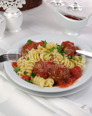 Pasta with meatballs in tomato sauce