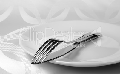 Knife and fork on a plate