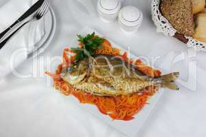 Fried Fish (Dorado) on a bed of vegetables