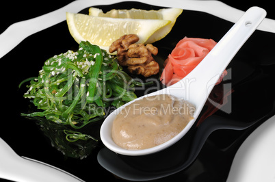 Chuka seaweed salad with peanut sauce, lemon and sesame seeds