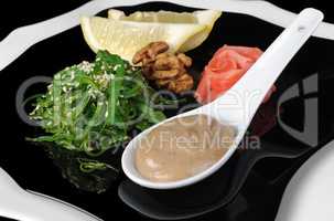 Chuka seaweed salad with peanut sauce, lemon and sesame seeds