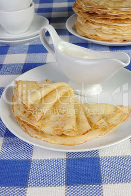 pancakes on a plate with milk sauce