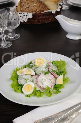 Radish salad with cucumber and eggs for milk sauce