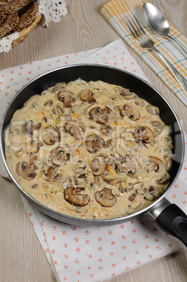 Fried mushrooms in a creamy sauce