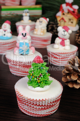 Sugar figurine Christmas tree on the muffin