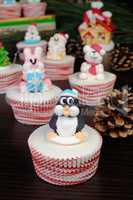 Sugar Christmas penguin figurine on a muffin
