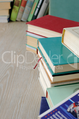 A variety of books in stacks on the table