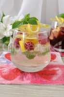 Fresh homemade lemonade with mint and raspberries