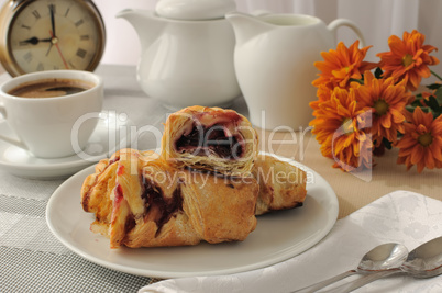 Morning cup of coffee and freshly baked cakes with cherries