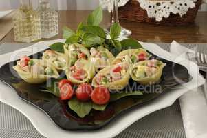 Sea shells pasta stuffed with vegetables and ham