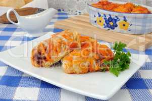 Cabbage rolls in tomato gravy with onions and carrots