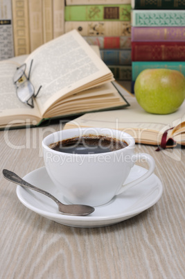 A cup of fragrant black coffee on the table against the backgrou