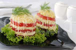 Appetizer of tomato slices with a sharp cheese filling