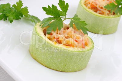 Zucchini stuffed with vegetables with rice and cheese