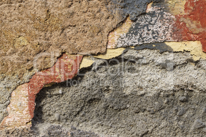 Close up of crumbling  wall with layers of peeled paint 1