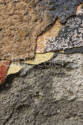 Close up of crumbling  wall with layers of peeled paint 8