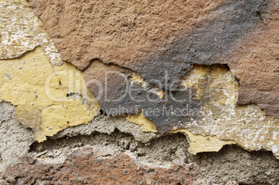 Close up of crumbling  wall with layers of peeled paint 6