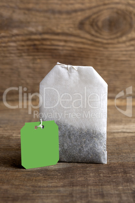 Teabag on wooden background