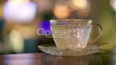 Hot water in glass tea cup