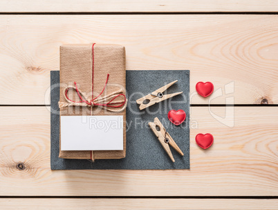 Gift box with white blank tag and hearts.