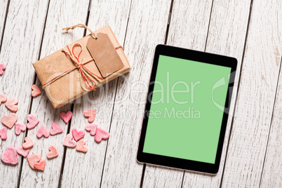 Mockup of tablet pc with gift box Mockup of tablet pc with gift box