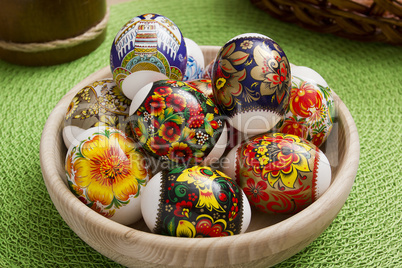 Easter eggs in a wooden plate