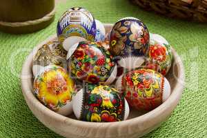 Easter eggs in a wooden plate